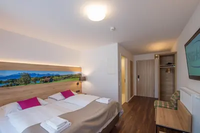 Ein Bett oder Betten in einem Zimmer der Unterkunft Stücklhof Eurasburg