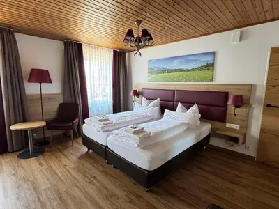 Ein Bett oder Betten in einem Zimmer der Unterkunft Hotel Weißbräu