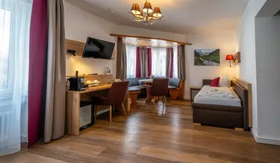 Ein Bett oder Betten in einem Zimmer der Unterkunft Hotel Weißbräu