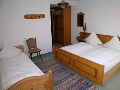 Ein Bett oder Betten in einem Zimmer der Unterkunft Landhotel Die Waldschänke