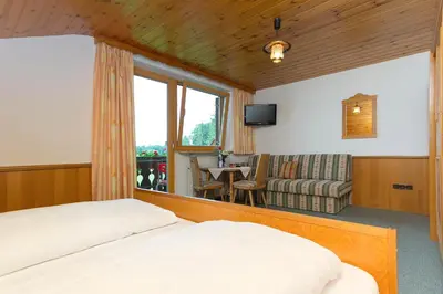 Ein Bett oder Betten in einem Zimmer der Unterkunft Landhotel Die Waldschänke