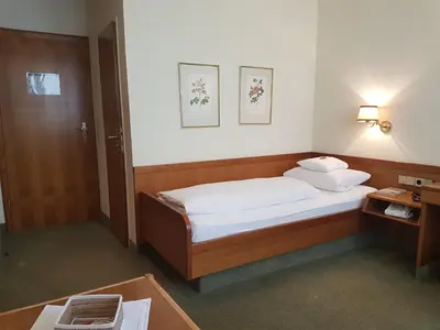 Ein Bett oder Betten in einem Zimmer der Unterkunft Kurhotel Roswitha