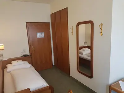 Ein Bett oder Betten in einem Zimmer der Unterkunft Kurhotel Roswitha