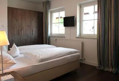 Ein Bett oder Betten in einem Zimmer der Unterkunft Hotel zur Sonne