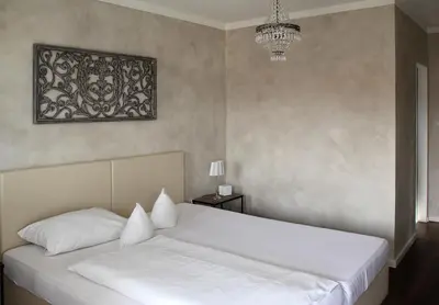 Ein Bett oder Betten in einem Zimmer der Unterkunft Hotel zur Sonne