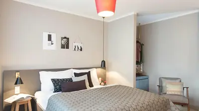 Ein Bett oder Betten in einem Zimmer der Unterkunft Bold Hotel München Zentrum