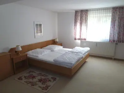 Ein Bett oder Betten in einem Zimmer der Unterkunft Ferienwohnanlage Hochgern