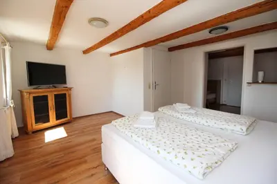 Ein Bett oder Betten in einem Zimmer der Unterkunft Gasthof Jägerwirt