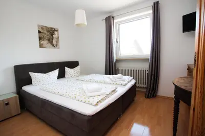 Ein Bett oder Betten in einem Zimmer der Unterkunft Gasthof Jägerwirt