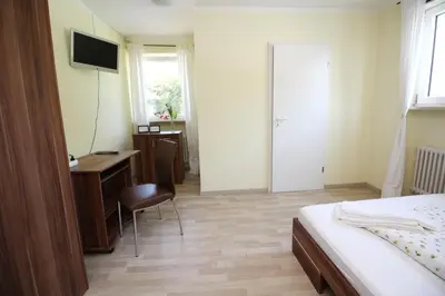 Ein Bett oder Betten in einem Zimmer der Unterkunft Gasthof Jägerwirt
