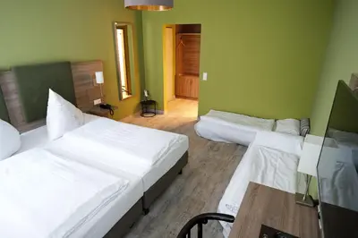 Ein Bett oder Betten in einem Zimmer der Unterkunft Hotel Römerstadt