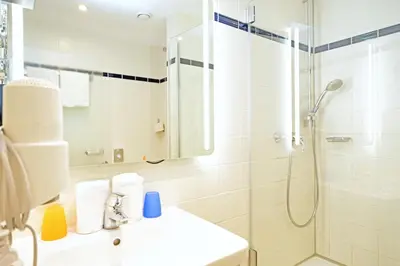 Ein Badezimmer in der Unterkunft Hotel Römerstadt