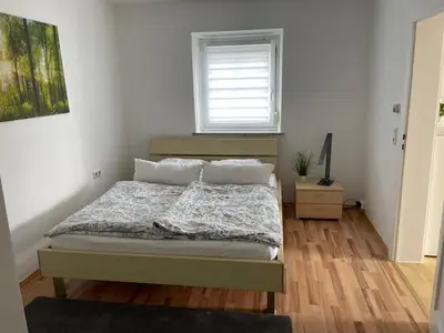 Ein Bett oder Betten in einem Zimmer der Unterkunft Kosumi Apartment
