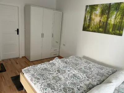 Ein Bett oder Betten in einem Zimmer der Unterkunft Kosumi Apartment
