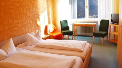 Ein Bett oder Betten in einem Zimmer der Unterkunft Hotel Paulanerstuben