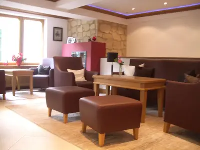 Ein Sitzbereich in der Unterkunft Hotel Germania