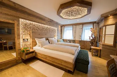 Ein Bett oder Betten in einem Zimmer der Unterkunft Wellness-Hotel ADLER