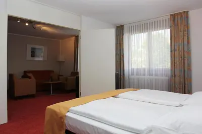 Ein Bett oder Betten in einem Zimmer der Unterkunft Hotel Gästehaus Forum am Westkreuz
