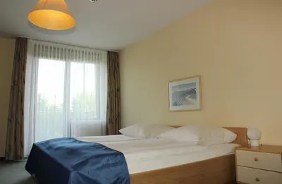Ein Bett oder Betten in einem Zimmer der Unterkunft Hotel Gästehaus Forum am Westkreuz