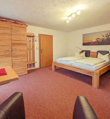 Ein Bett oder Betten in einem Zimmer der Unterkunft Pension Wagnerhof