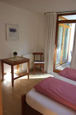 Ein Bett oder Betten in einem Zimmer der Unterkunft Ferienwohnungen Almrausch
