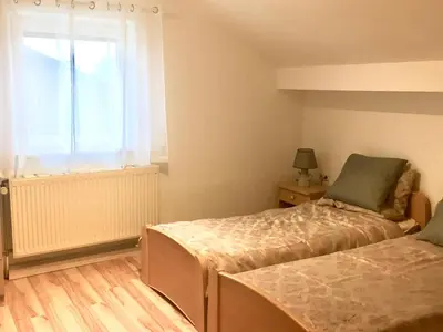 Ein Bett oder Betten in einem Zimmer der Unterkunft Bavarian Holiday Home - A94 Autobahn