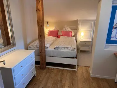 Ein Bett oder Betten in einem Zimmer der Unterkunft Ferienwohnung Giacomelli 2