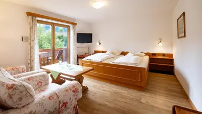 Ein Bett oder Betten in einem Zimmer der Unterkunft Gästehaus Maier zum Bitscher