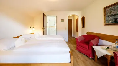 Ein Bett oder Betten in einem Zimmer der Unterkunft Gästehaus Maier zum Bitscher