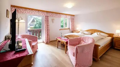 Ein Bett oder Betten in einem Zimmer der Unterkunft Gästehaus Maier zum Bitscher