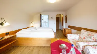 Ein Bett oder Betten in einem Zimmer der Unterkunft Gästehaus Maier zum Bitscher