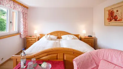 Ein Bett oder Betten in einem Zimmer der Unterkunft Gästehaus Maier zum Bitscher