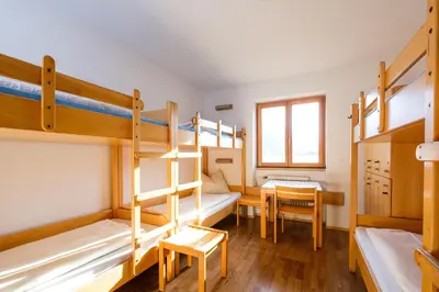 Ein Bett oder Betten in einem Zimmer der Unterkunft Jugendherberge Mittenwald