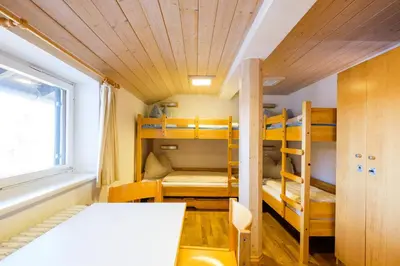 Ein Bett oder Betten in einem Zimmer der Unterkunft Jugendherberge Mittenwald