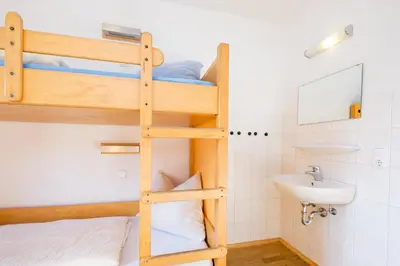 Ein Bett oder Betten in einem Zimmer der Unterkunft Jugendherberge Mittenwald