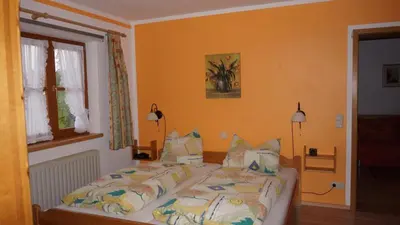 Ein Bett oder Betten in einem Zimmer der Unterkunft Paulhuberhof