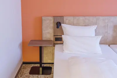 Ein Bett oder Betten in einem Zimmer der Unterkunft Atomis Hotel Munich Airport by Mercure