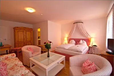 Ein Bett oder Betten in einem Zimmer der Unterkunft Altstadthotel Bauern Bräu Schrobenhausen
