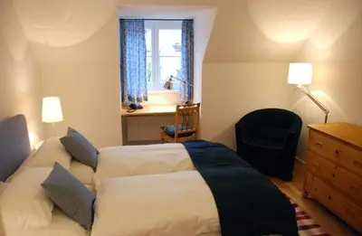 Ein Bett oder Betten in einem Zimmer der Unterkunft Altstadthotel Bauern Bräu Schrobenhausen