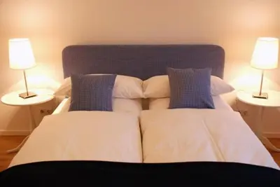 Ein Bett oder Betten in einem Zimmer der Unterkunft Altstadthotel Bauern Bräu Schrobenhausen