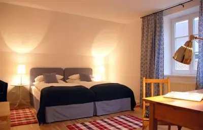 Ein Bett oder Betten in einem Zimmer der Unterkunft Altstadthotel Bauern Bräu Schrobenhausen