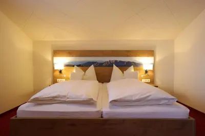 Ein Bett oder Betten in einem Zimmer der Unterkunft Gästehaus Heimgarten