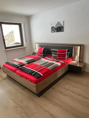 Ein Bett oder Betten in einem Zimmer der Unterkunft Ferienwohnung Strohmeyer