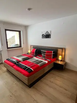Ein Bett oder Betten in einem Zimmer der Unterkunft Ferienwohnung Strohmeyer