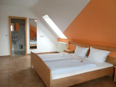 Ein Bett oder Betten in einem Zimmer der Unterkunft Landgasthof Asum