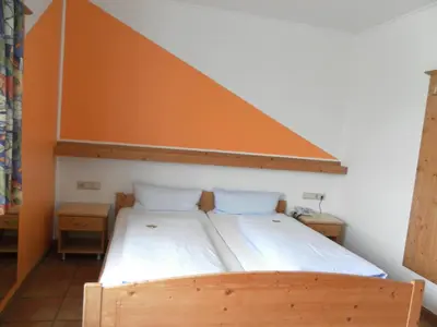 Ein Bett oder Betten in einem Zimmer der Unterkunft Landgasthof Asum