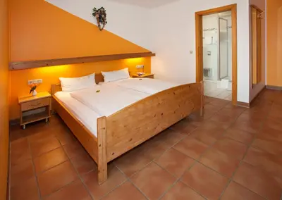 Ein Bett oder Betten in einem Zimmer der Unterkunft Landgasthof Asum