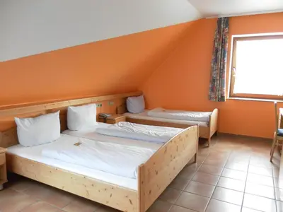 Ein Bett oder Betten in einem Zimmer der Unterkunft Landgasthof Asum