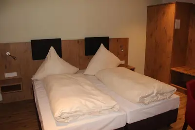Ein Bett oder Betten in einem Zimmer der Unterkunft Gasthof Zur Post