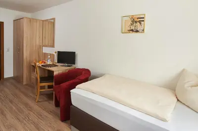 Ein Bett oder Betten in einem Zimmer der Unterkunft Gasthof Gigl
